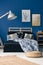 Blue bedroom with wooden furniture