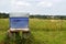 Blue beehive in the countryside