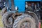 blue belarussian tractors, wheels and opened diesel engine compartments view