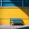 a blue bench sitting in front of a yellow wall