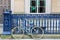 Blue Bike Leans Against Blue Iron Railing in Scotland