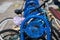 Blue bike rack with old bikes on the main street on Balboa Island