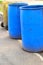 Blue bins in the street.