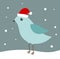 Blue bird in Santa hat in winter scenery