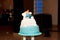 Blue birthday cake with doll character