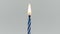 Blue birthday candles light on isolated white