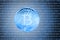 Blue bitcoin over digital background