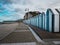 Blue and black beach huts on the pebble beach of Yport, Normandy