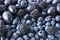 Blue and black food. Background of fruits and berries. Fresh blackberries, blueberries, plums and grapes.