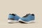 Blue and black sport shoes over beige