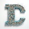 Blue And Blue Textured Letter \\\'technology\\\' With Wood Chips And Stones