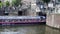 Blue Boat Canal Cruise Ship with tourists on touring the canals through city, boat