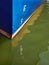 Blue Boat Hull and Reflection in Water