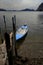 Blue Boat in lake at island Monte Isola at Lake Iseo in Italy