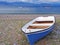 Blue boat on Nikolaiika Beach and the Corinthian Gulf, Greece