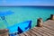Blue boat in wooden tropical pier in Caribbean