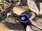 Blue bowl with gazing ball on desert rocks