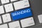 Blue Branding Button on Keyboard. 3D.