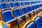 Blue brown wooden chairs in the auditorium. Without people