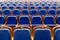 Blue brown wooden chairs in the auditorium. Without people