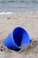 Blue Bucket on beach sand