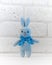 The blue bunny stands