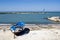 Blue burnt boat on the seashore Bari, Italy