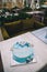 Blue cake with mastic cross and angels for boy christening party.