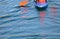 Blue canoe boat on the lake with rower