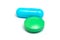 Blue capsule and green pill