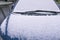 Blue car covered with snow. Fragment. Winter scene. Copy space for text