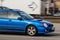Blue car is driving down the street. Subaru Impreza. Motion blur. Riga, Latvia - 06 Apr 2022