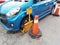 Blue car lock penalty double traffic cone