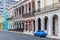 Blue car and old buldings in Havana, Cuba