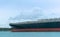 Blue cargo ship on water, huge empty container ship