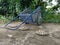 A blue cart on a cement floor