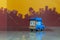 Blue cartoon car toy selective focus on blur city background