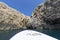 Blue Cave carved in the limestone by the Adriatic Sea, tourists sailing by boat to the grotto, Bisevo Island, Croatia