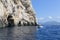 Blue Cave carved in the limestone by the Adriatic Sea, tourists sailing by boat to the grotto, Bisevo Island, Croatia