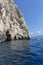 Blue Cave carved in the limestone by the Adriatic Sea, tourists sailing by boat to the grotto, Bisevo Island, Croatia