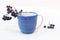 Blue ceramic Cup. Sprigs of black chokeberry. Souvenir from ceramics. Manual work. Crockery