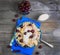 In blue ceramic dish, fruit and berry dumplings with cherries