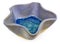 Blue, ceramic, handmade bowl in the shape of a star. At the bottom broken glass with bubbles of air.