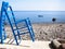 Blue chairs rocky beach