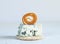 Blue cheese on cracker with candied peach roll decoration