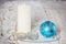 Blue Christmas ball, white candle and beads