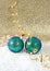 Blue christmas baubles with golden streamer