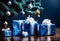 blue christmas gift parcels under a tree decorated with matching baubles