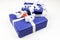 Blue Christmas packages with white ribbons and a little Santa Claus