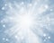 Blue Christmas winter holidays background with glowing rays.